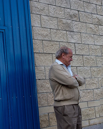 Blue Door, Block Wall and a Man, Luarca
