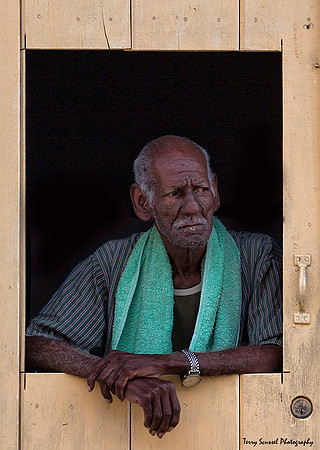 Man in Yellow Window