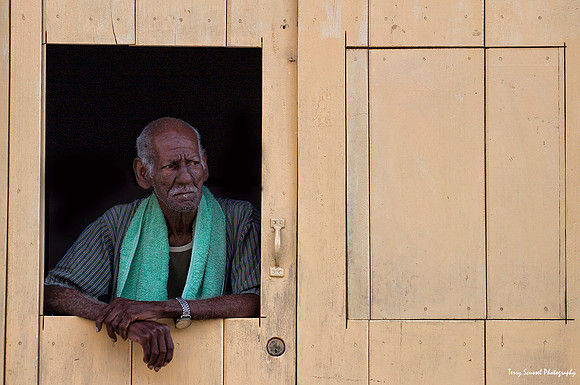 Man in Yellow Window